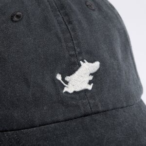 A close-up of the Moomin Cap - Black, which features a small white embroidered cartoon character walking—reminiscent of the charming Moomin figures seen on keyrings—on the front panel. Gate21.ee
