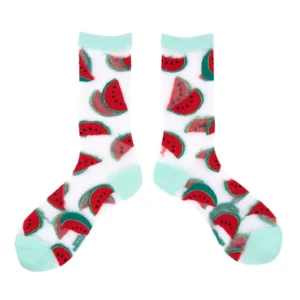 A pair of Watermelons - Transparent Socks featuring a playful repeating watermelon slice pattern, with light blue toes, heels, and cuffs, reminiscent of the Coucou Suzette style. The white crew socks are laid flat against a white background. Gate21.ee