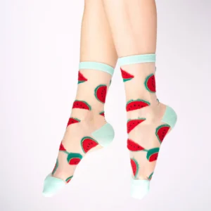 A pair of feet wearing Watermelons - Transparent Socks, featuring a sheer design with light blue toe, heel, and cuff, decorated with playful red and green watermelon slice patterns. Gate21.ee
