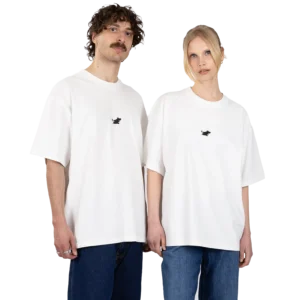 Two people stand side by side against a plain white background, both wearing the Moomin Heavy Ts in white — loose-fit T-shirts featuring a small black embroidered design on the left chest — paired with blue jeans. Gate21.ee