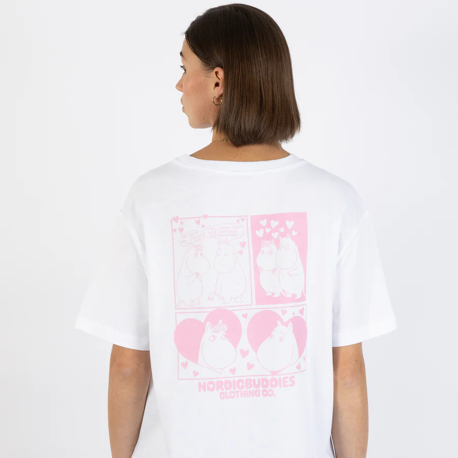 A person with short brown hair is seen from behind wearing the “Moomin Ts - Love - White” T-shirt, which features pink cartoon Moomin characters and hearts on the back, along with the text NORDICBUDDIES CLOTHING CO. Gate21.ee