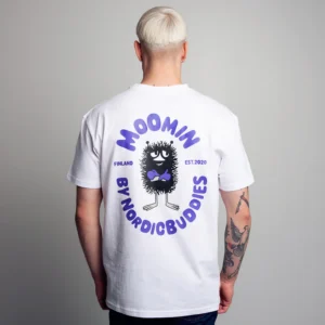 A person with short, blond hair faces away, wearing the Moomin Ts - Stinky - White T-shirt: a white shirt featuring the black cartoon character Stinky, purple text reading “MOOMIN BY NORDICBUDDIES,” and smaller text “Finland” and “EST.2020” on the back. Gate21.ee