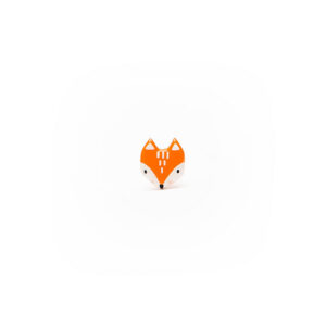 A small, orange, fox-shaped pin with white and black details from the ABE jewellery - Pins collection is centred on a plain white background, making a charming addition to any jewellery assortment. Gate21.ee