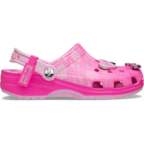 The Crocs Barbie® Classic Clog is a pink and light pink Classic Clog-style shoe featuring ventilation holes, a back strap, and decorative Barbie charms on the top. This Crocs shoe also includes a textured sole and showcases a mix of patterns alongside solid colours. Gate21.ee