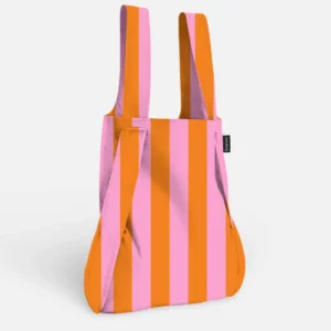 A Stripes - Orange Notabag tote bag featuring vertical orange and pink stripes, two handles, and a small black label on the side, is photographed against a plain white background. Gate21.ee