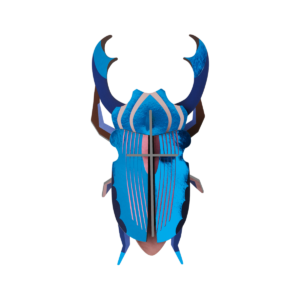 The Azure Stag Beetle mask—a decorative piece featuring blue and brown hues, stylised horns, pink accents, and sleek lines from the StudioROOF parasaul collection—is shown against a plain white background. Gate21.ee