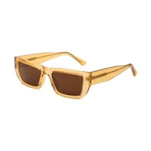 A pair of FAME - Yellow Transparent rectangular sunglasses by A. Kjærbede, featuring thick, translucent yellow frames and dark brown lenses, displayed against a white background. Gate21.ee