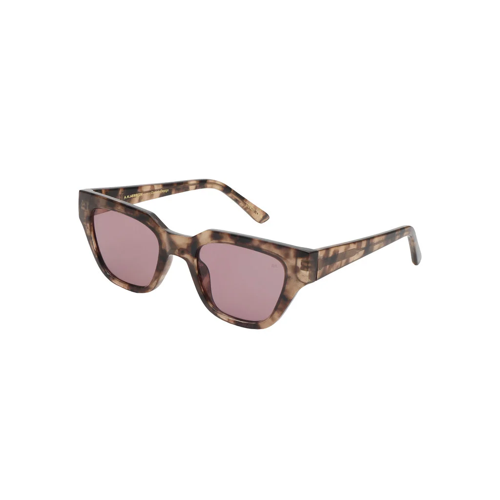 KAWS - Coquina sunglasses in brown tortoiseshell, featuring square frames and pink-tinted lenses, shown angled to the right on a white background. Gate21.ee