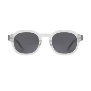 The Zan - Crystal sunglasses by A. Kjærbede are featured centred on a plain white background, showcasing clear geometric frames, dark rectangular lenses, and sleek black arms for a modern minimalist look. Gate21.ee