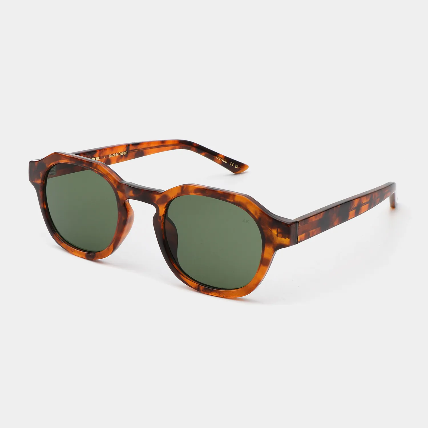 A pair of Zan - Havana sunglasses by A. Kjærbede, featuring round tortoiseshell frames and dark green lenses, is shown against a plain white background. Gate21.ee