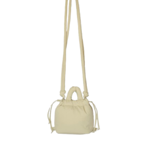 A compact, butter yellow Micro Ona Soft Bag with a long, slim shoulder strap and two short handles, displayed against a plain white background. Gate21.ee