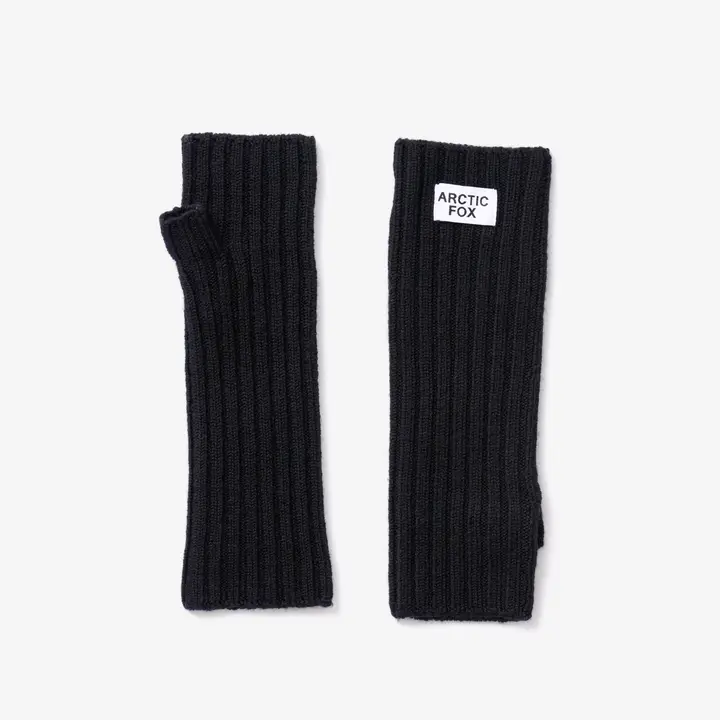 Two black Merino Wool Fingerless Gloves are laid flat on a white background. One glove features a white rectangular label reading “ARCTIC FOX” sewn near the top edge, highlighting these as authentic Merino Wool Fingerless Gloves - Black by Arctic Fox Reykjavik. Gate21.ee
