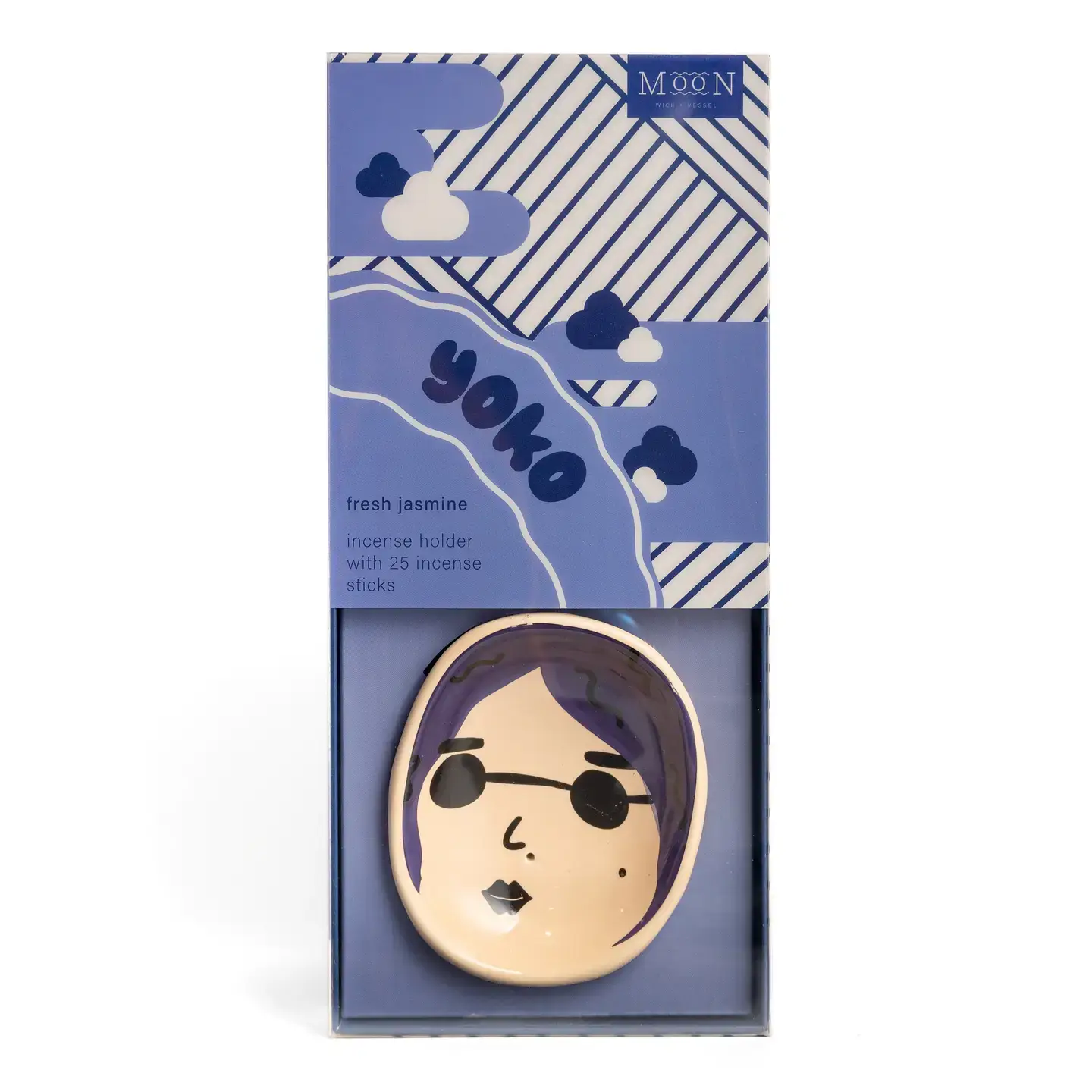 Yoko Faces - Incense Burner: This boxed incense holder features a charming cartoon face with purple hair, labelled “yoko.” Presented in packaging decorated with blue and white diagonal stripes and clouds, it reads “fresh jasmine incense holder with 25 incense sticks.” A playful addition to your Wick & Vessel home fragrance collection. Gate21.ee