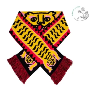 This vibrant “Puppy - Organic” Kabak scarf with red fringe features a yellow and black stylised dog face and paw design. The scarf has red and black zigzag edges, along with a small organic cotton symbol in the top right corner. Gate21.ee